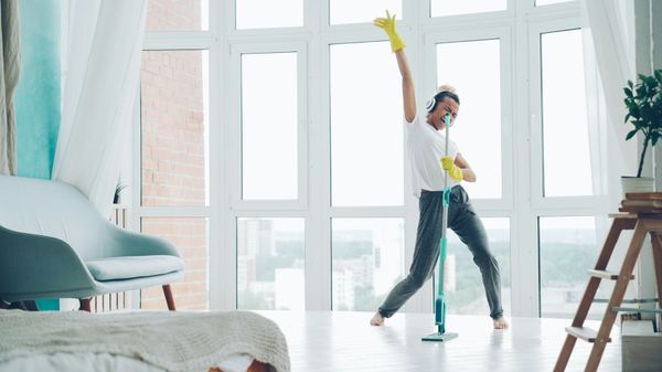 Professional cleaner cleaning a modern home