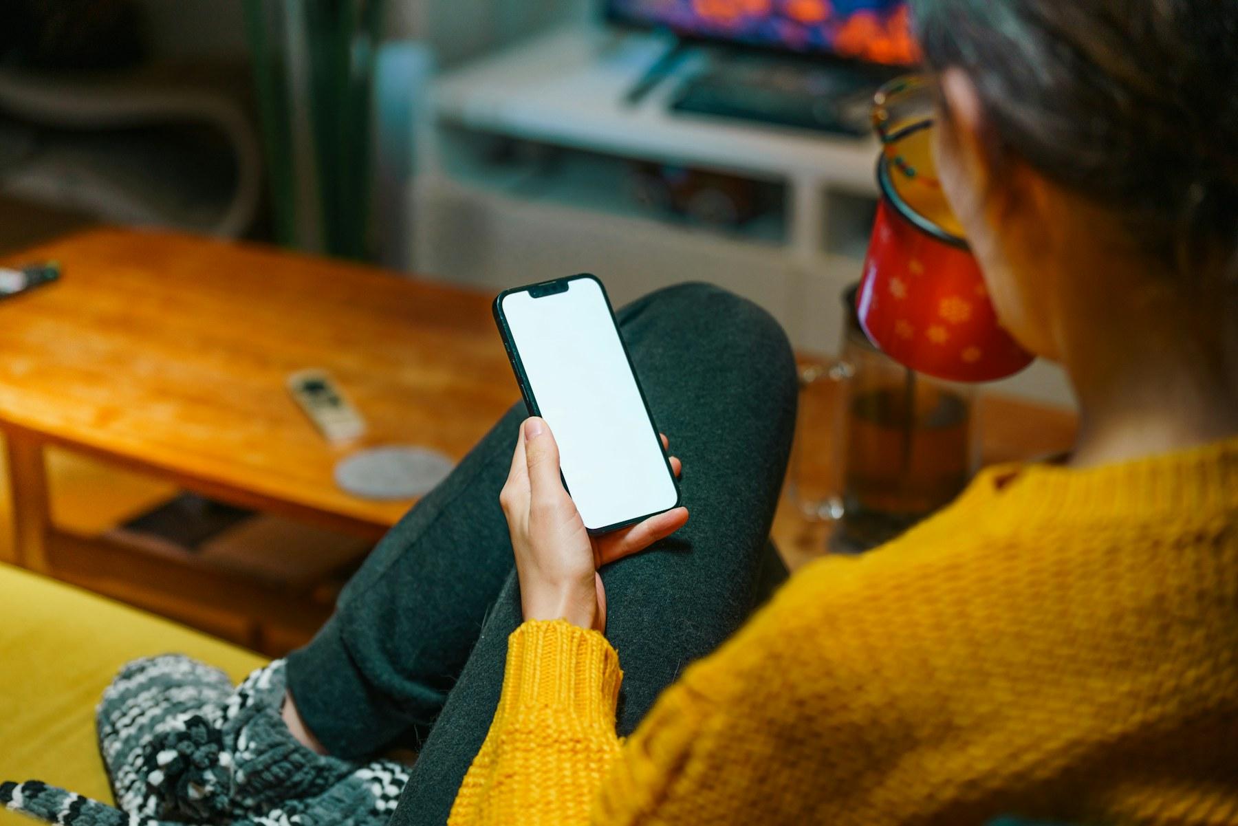 A person booking a service on a phone.